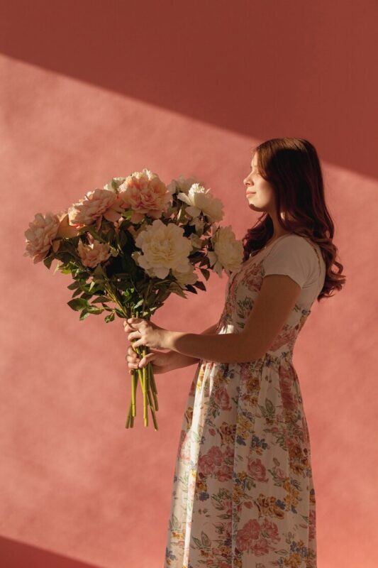 elegant-beautiful-woman-holding-flower-bouquet_23-2148442552